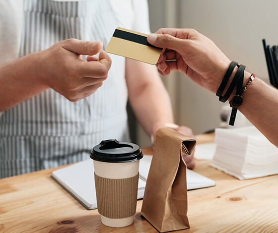 Customer purchasing a coffee with credit card